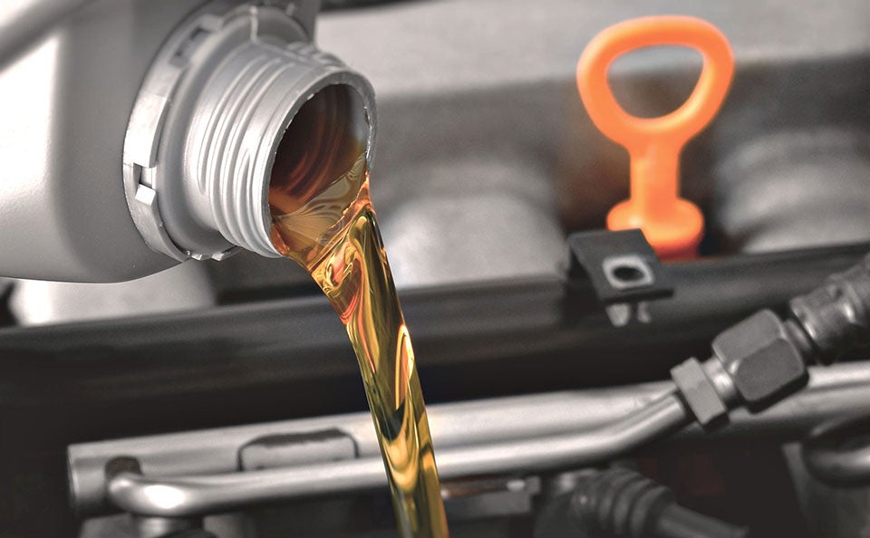 oil change being performed on Honda vehicle